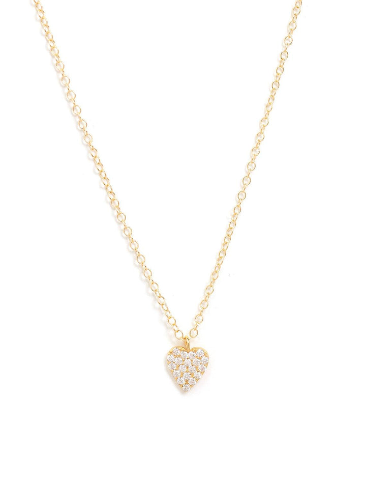 Kris Nations' heart crystal charm necklace in gold.