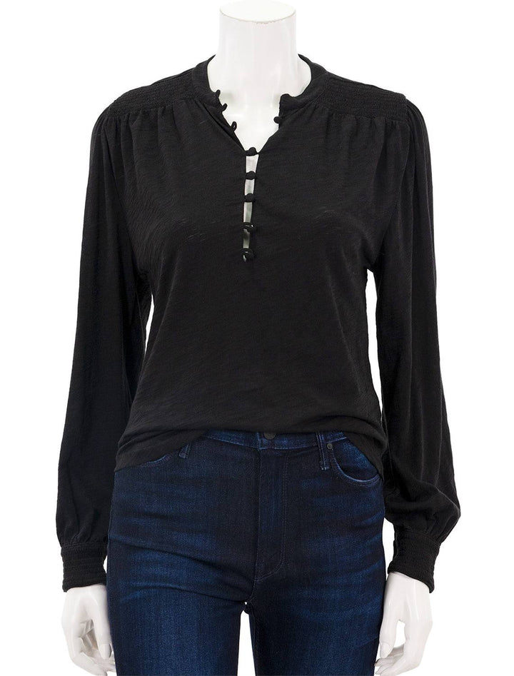 Front view of Goldie Lewinter's peasant blouse with smocking in black.