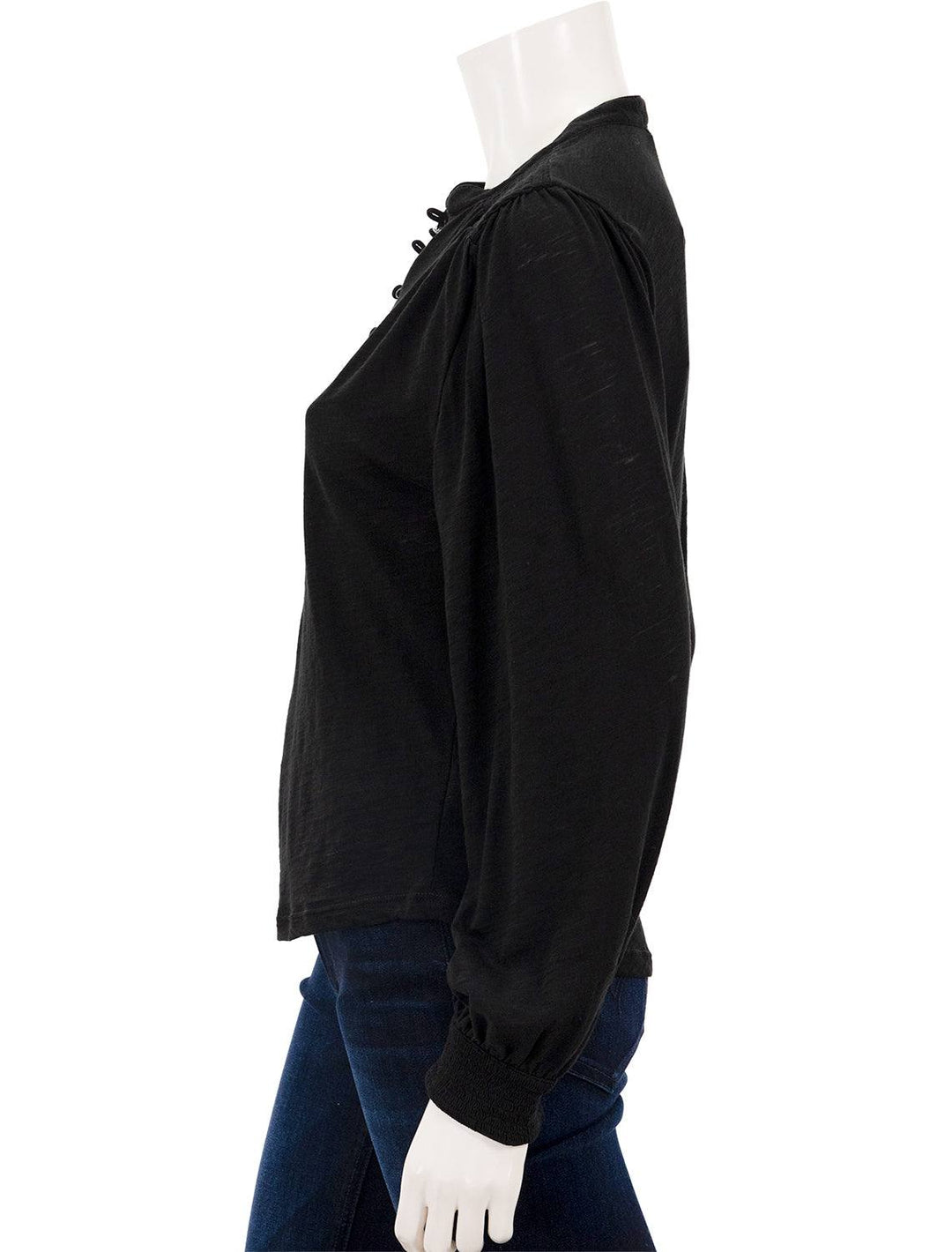Side view of Goldie Lewinter's peasant blouse with smocking in black.