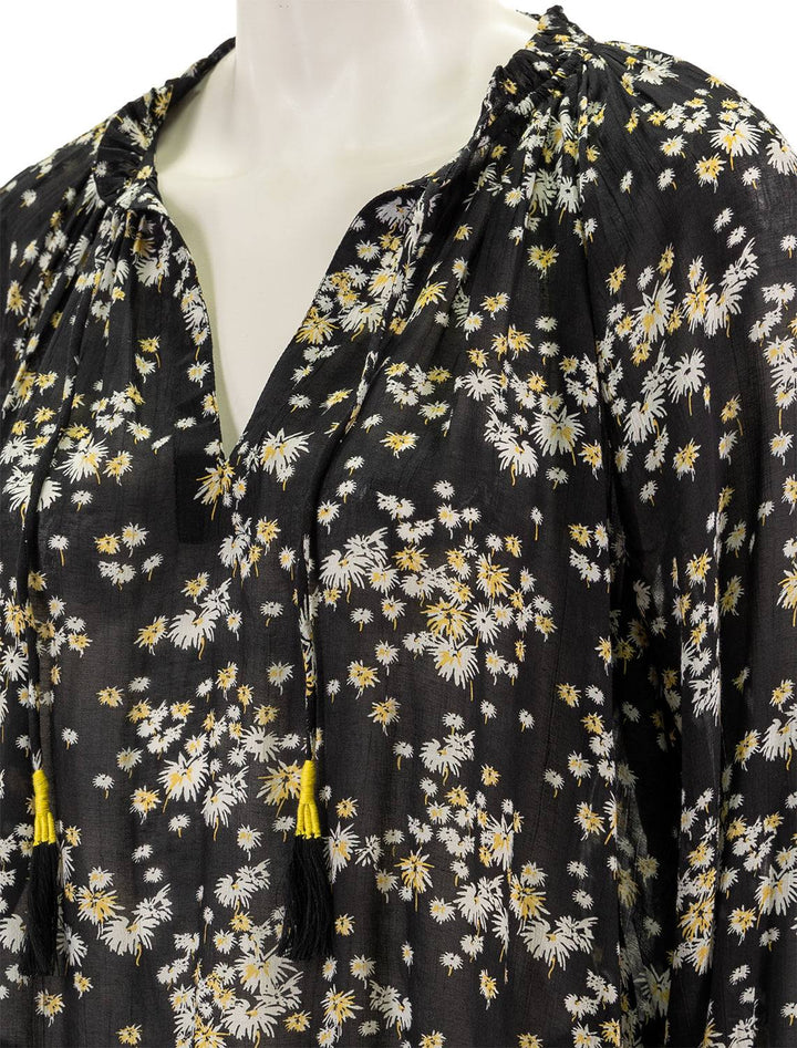 Close-up view of Scotch & Soda's dandelion print contrast ruffle blouse in black.