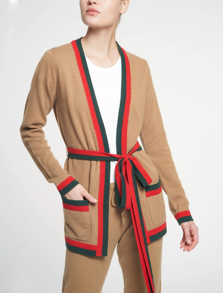 Model wearing Madeline Thompson's rowen cardigan in camel stripe.
