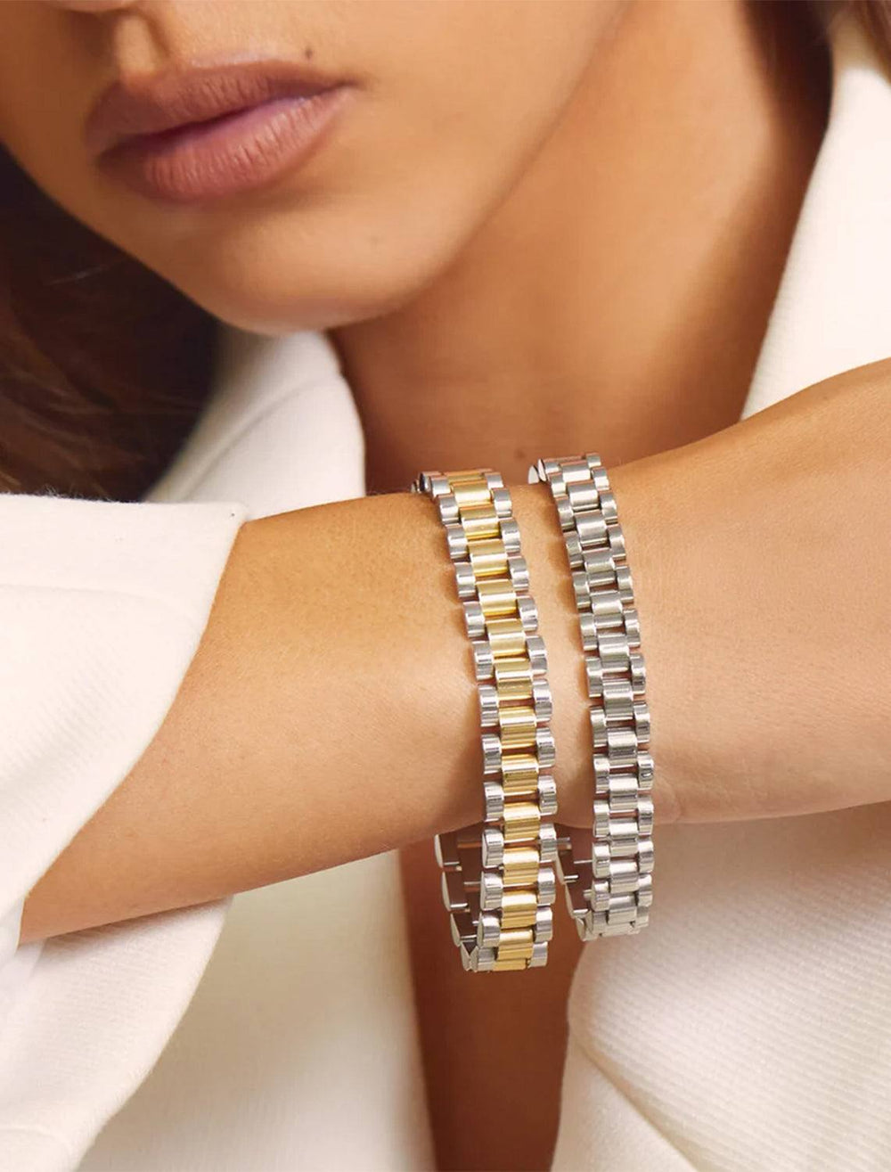 Model wearing Luv AJ's timepiece bracelet in silver.