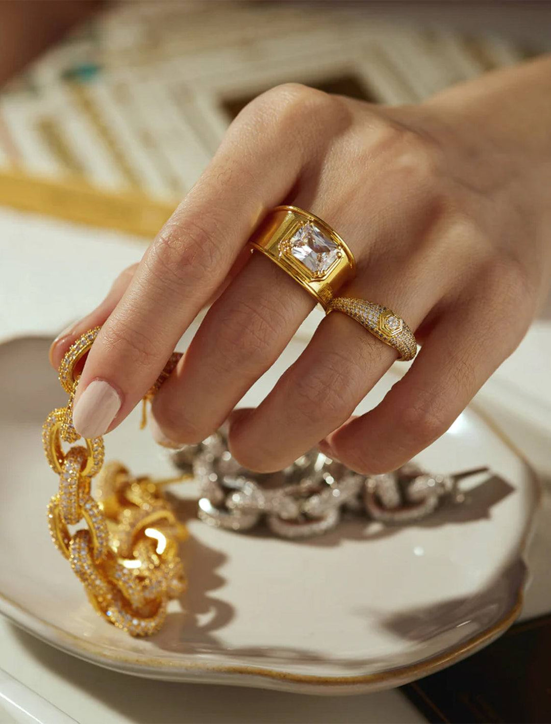 Model wearing Luv AJ's pave hex signet ring in gold.