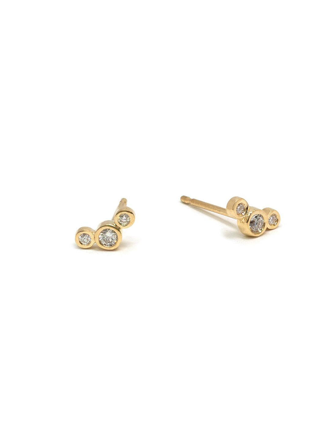 Front view of Zoe Chicco's 14k 3 diamond curved studs.