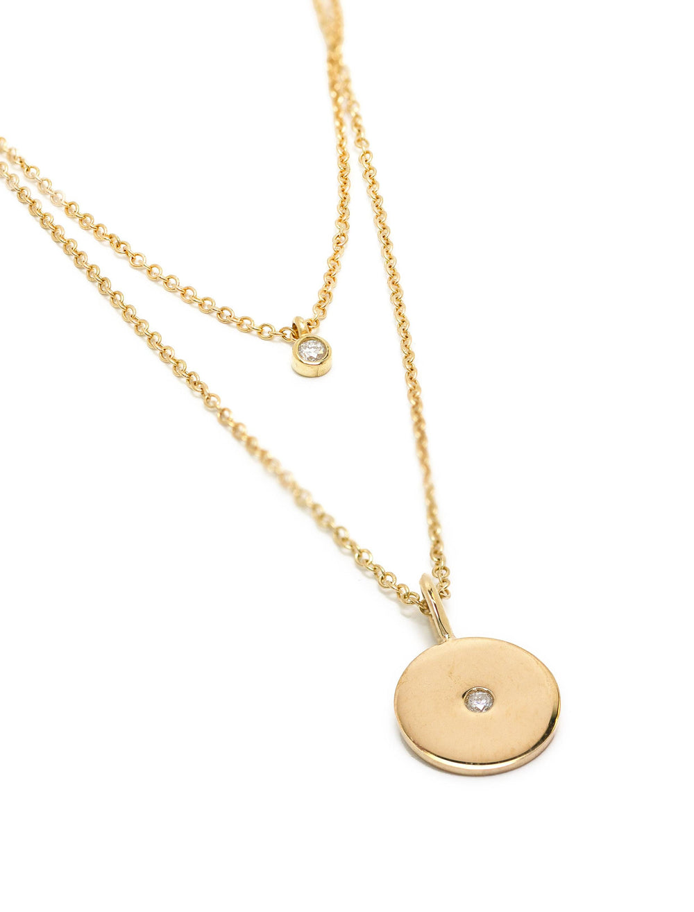 Close-up view of Zoe Chicco's 14k double layer diamond and disc necklace.