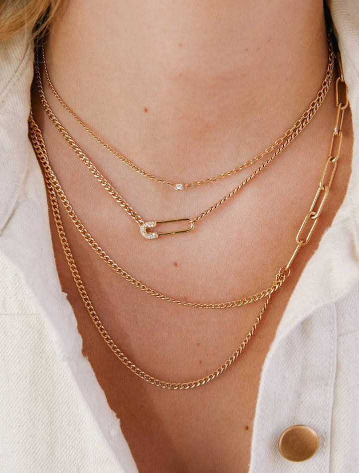 Model wearing Zoe Chicco's 14K Asymmetric Layered Curb and Paperclip Chain Necklace in Gold.