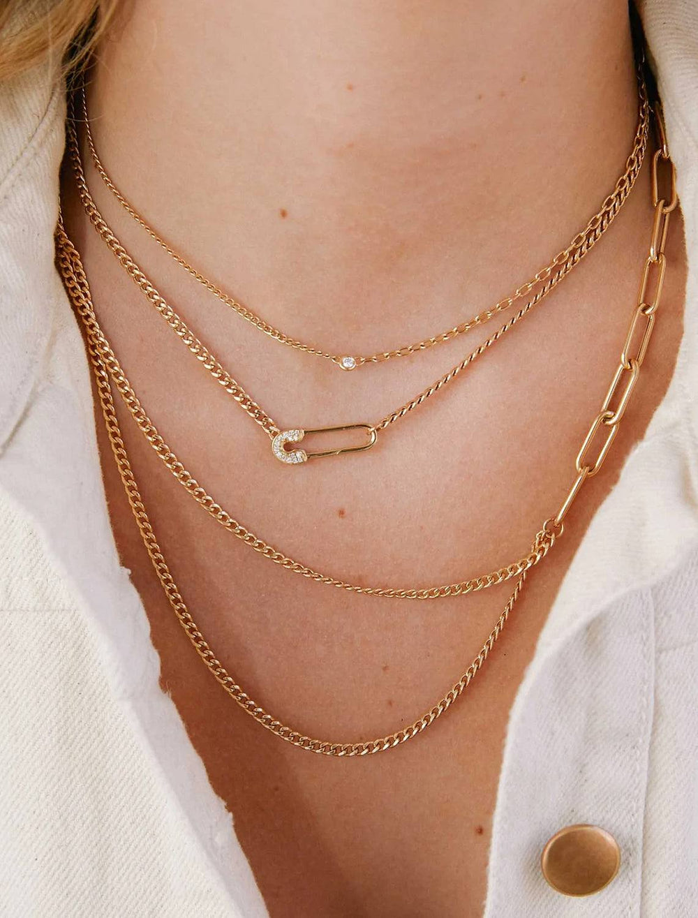 Model wearing Zoe Chicco's 14K Asymmetric Layered Curb and Paperclip Chain Necklace in Gold.