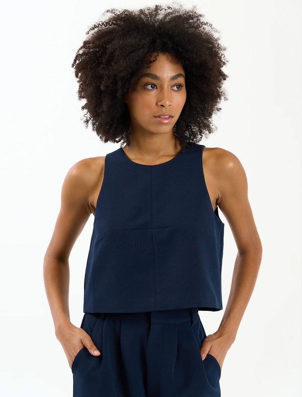 Model wearing Sundays NYC's rae top in navy.