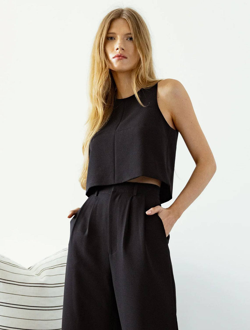 Model wearing Sundays NYC's rae top in black.