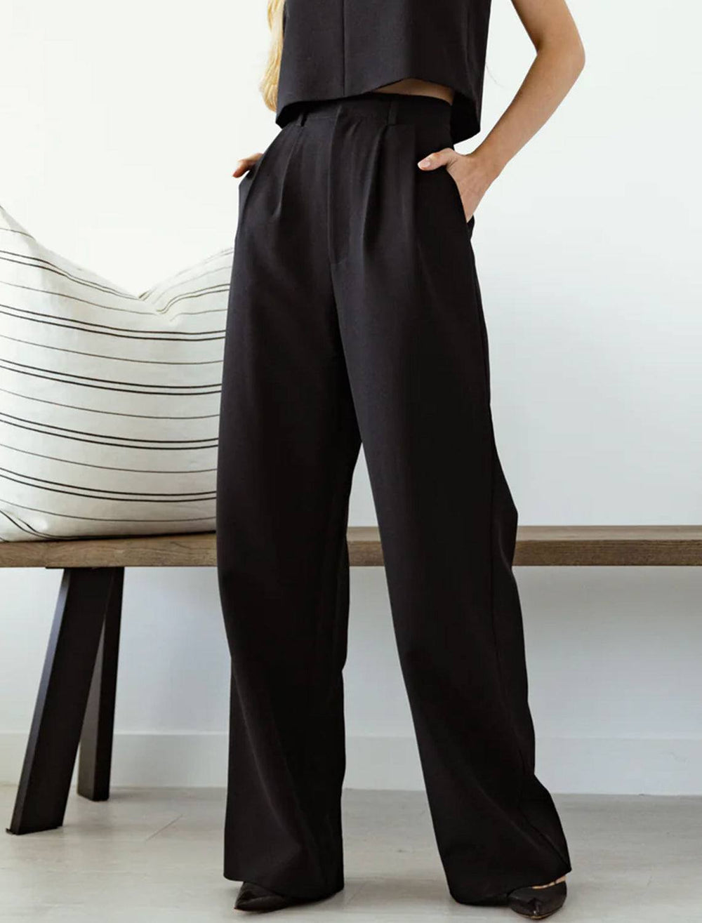 Model wearing Sundays NYC's gentry trousers in black.