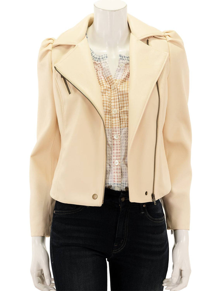 Front view of Marie Oliver's maeve moto jacket in sand, unzipped.