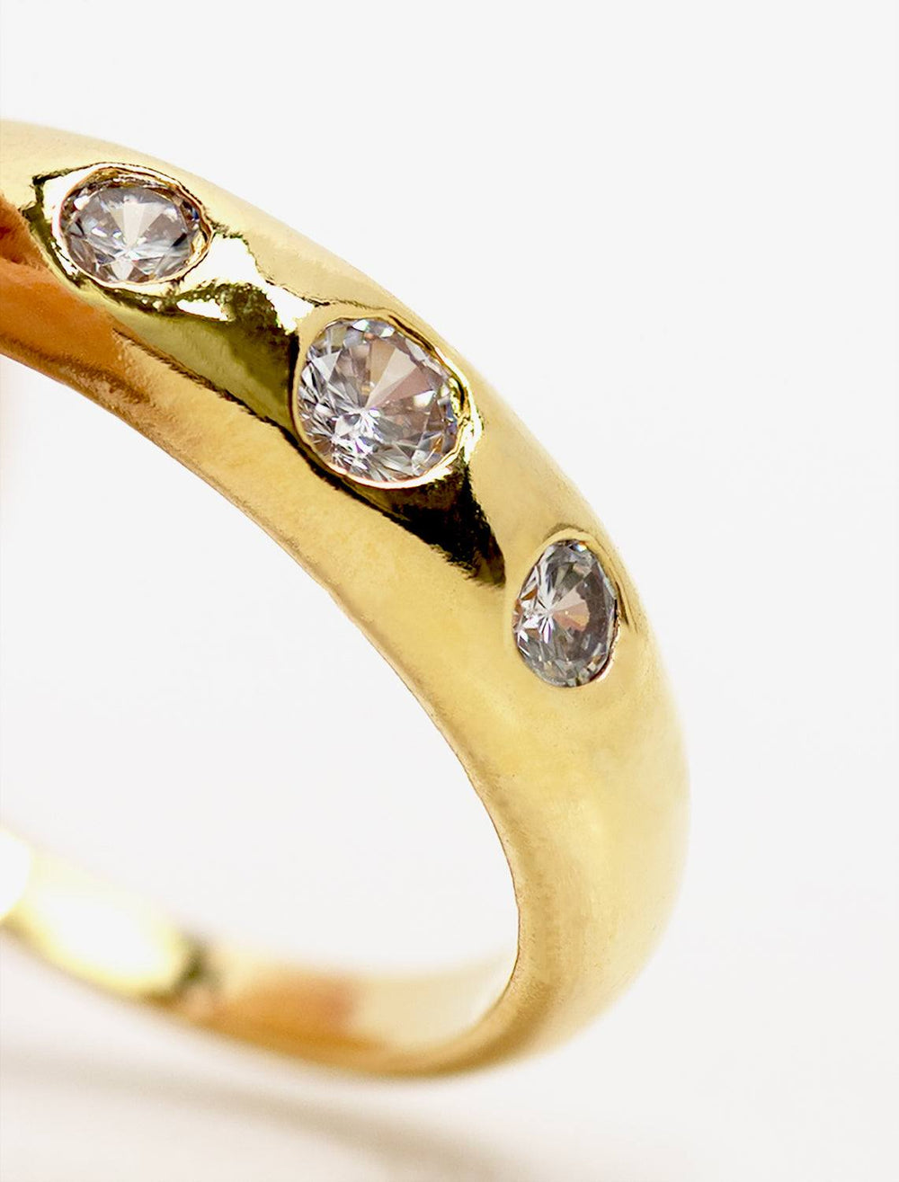 Tai jewelry's stone accented dome band in gold.