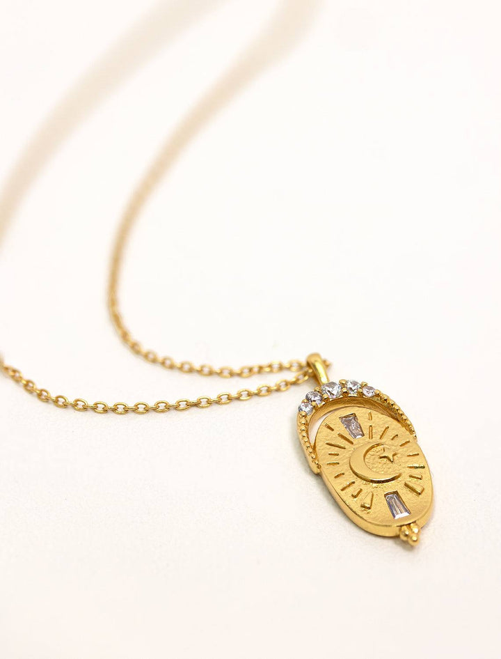 Tai jewelry's rounded coin necklace in gold.