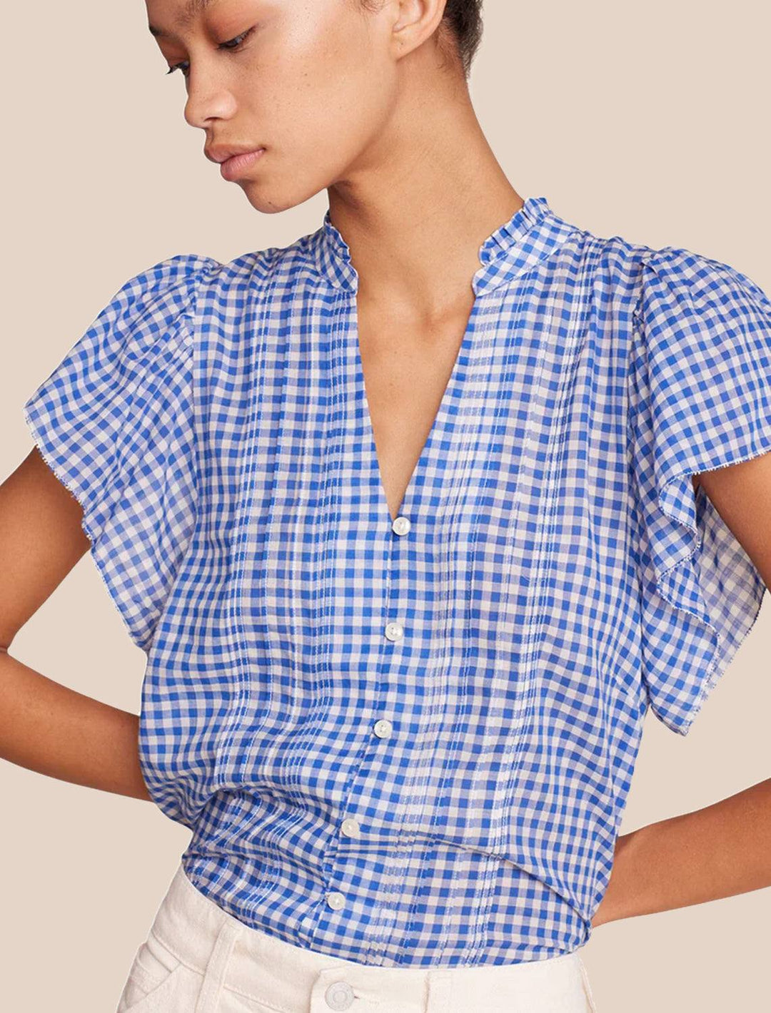 Model wearing Birds of Paradis' cate blouse in cobalt check.