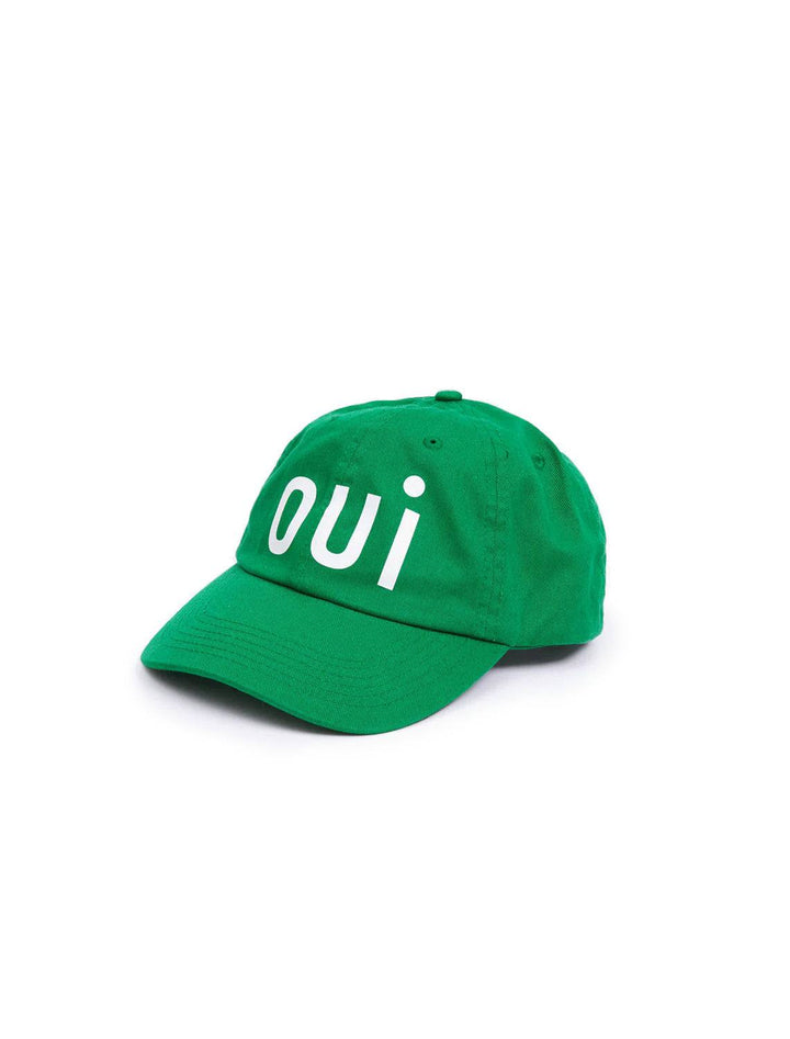 Side angle view of Clare V.'s oui baseball hat in green.