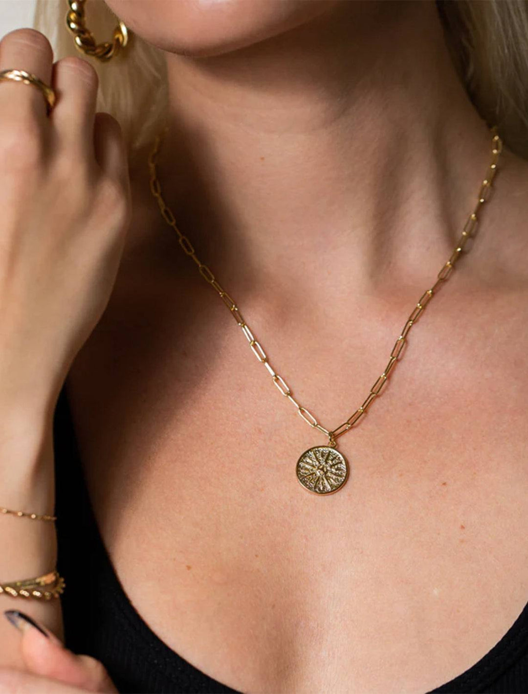 model wearing atlas medallion necklace in gold
