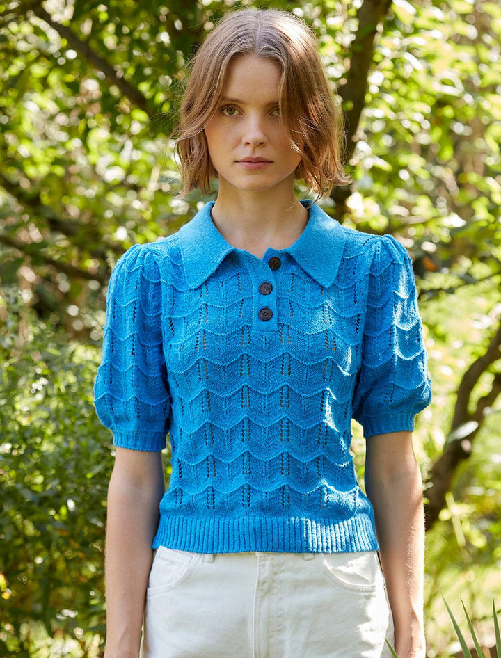 Model wearing Vox Lux's Crocheted Polo Sweater in Turquoise.