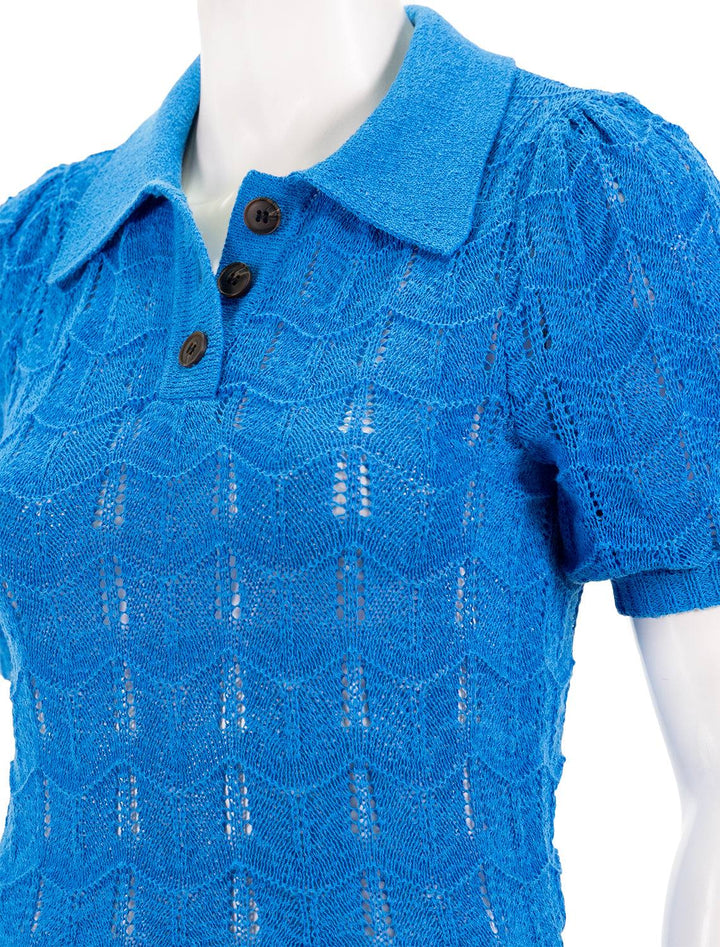 Close-up view of Vox Lux's Crocheted Polo Sweater in Turquoise.