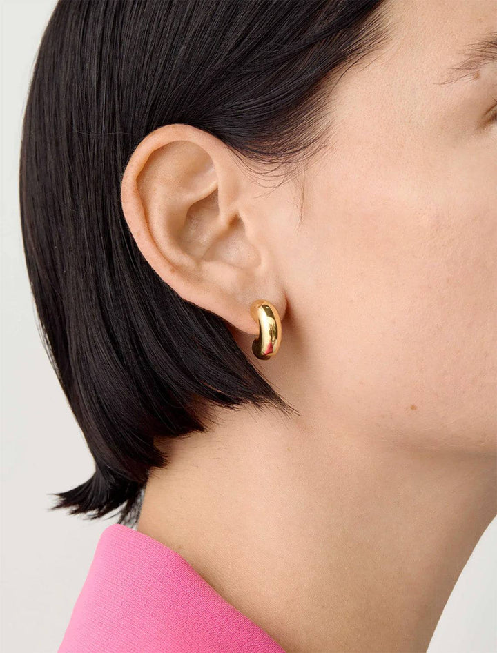 Model wearing Jenny Bird's Small Tome Hoops in 14K Gold-Dipped Brass.