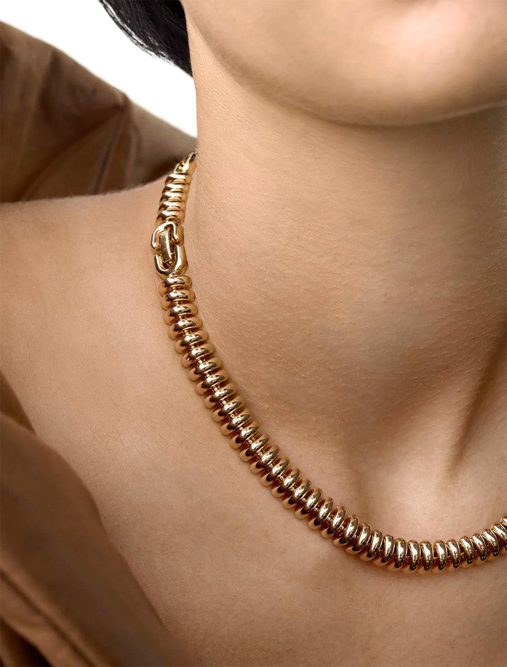 Model wearing Jenny Bird's Sofia Choker Necklace in Gold Tone Dipped Brass.