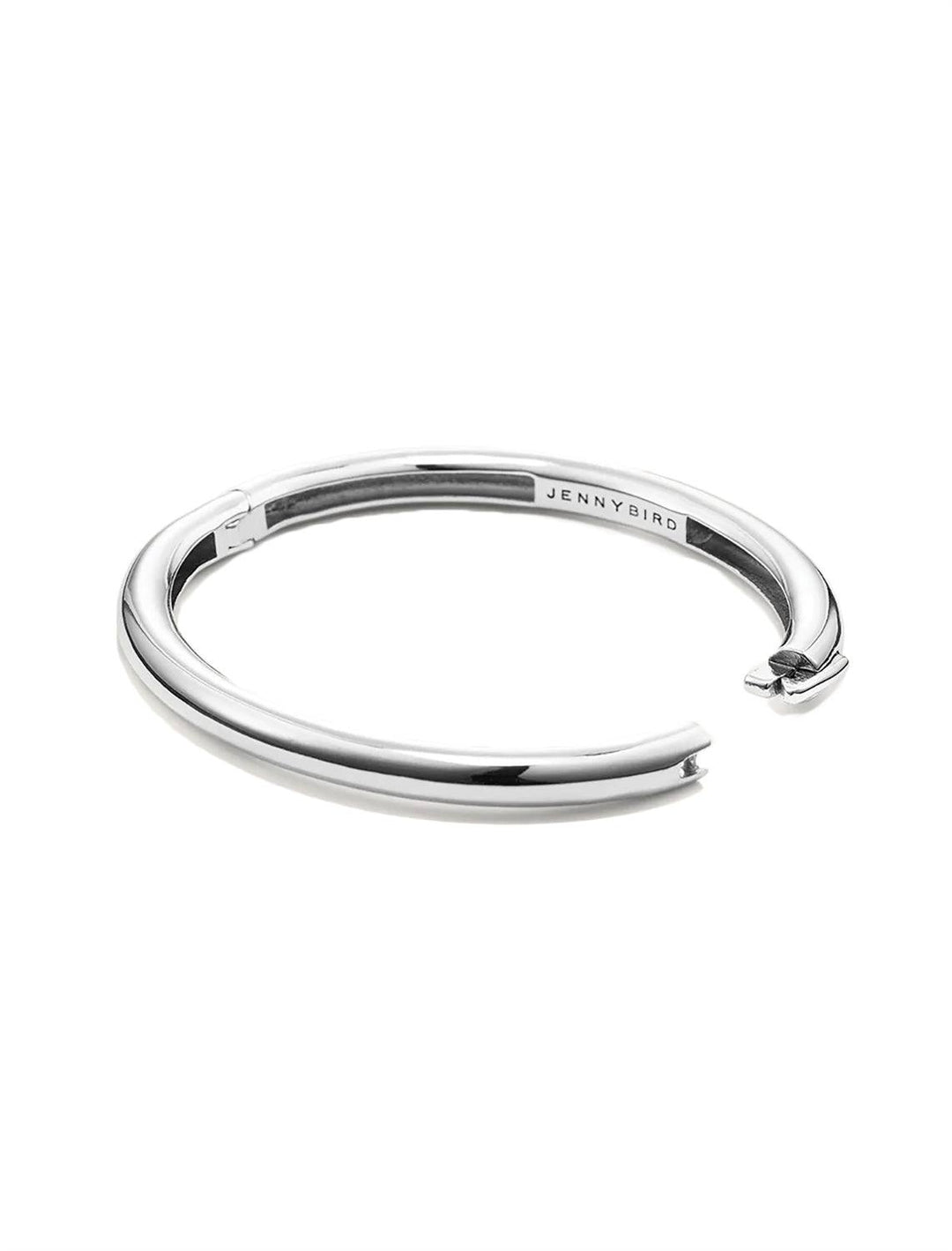 Side view of Jenny Bird's Gia Bangle in Silver Dipped Brass, with the clasp open.