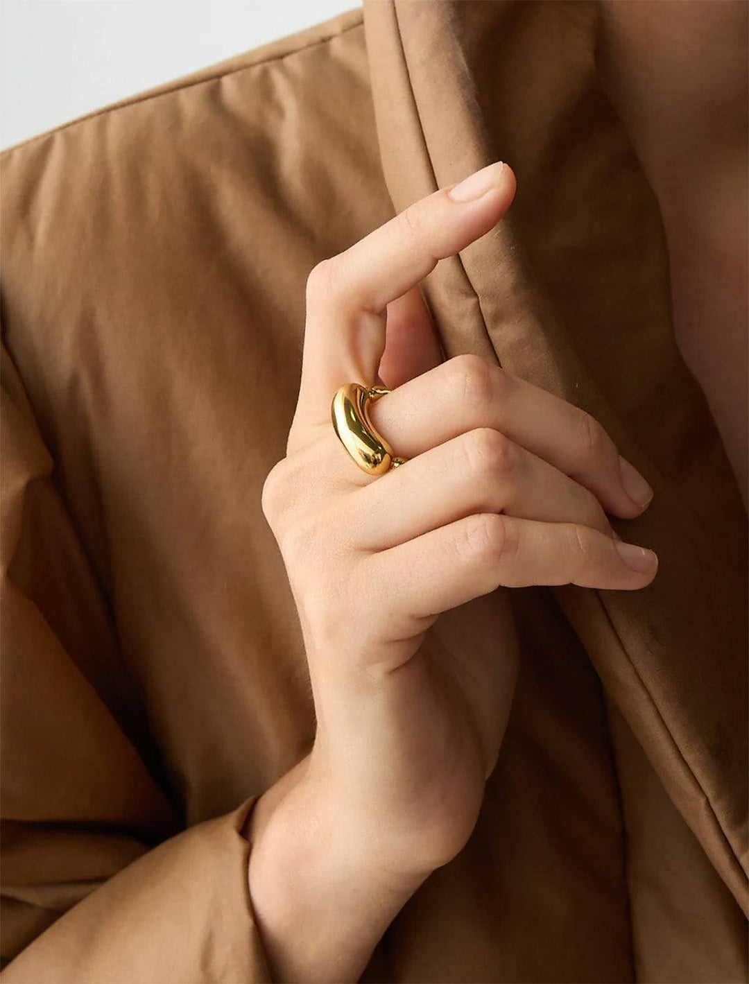 Model wearing Jenny Bird's Izabella Ring in Gold-Ion Plated Brass.