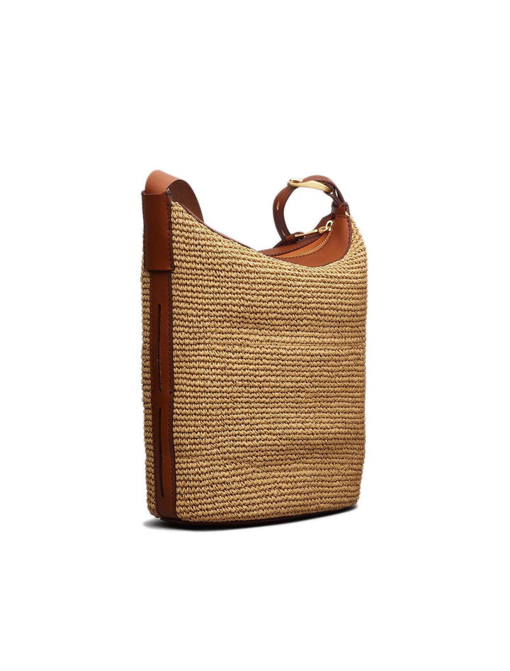 Side angle view of Rag & Bone's belize bucket bag in straw.
