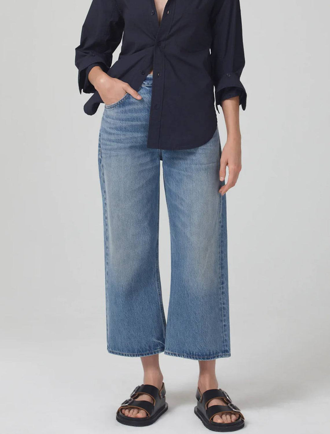Model wearing Citizens of Humanity's gaucho vintage wide leg in sodapop.