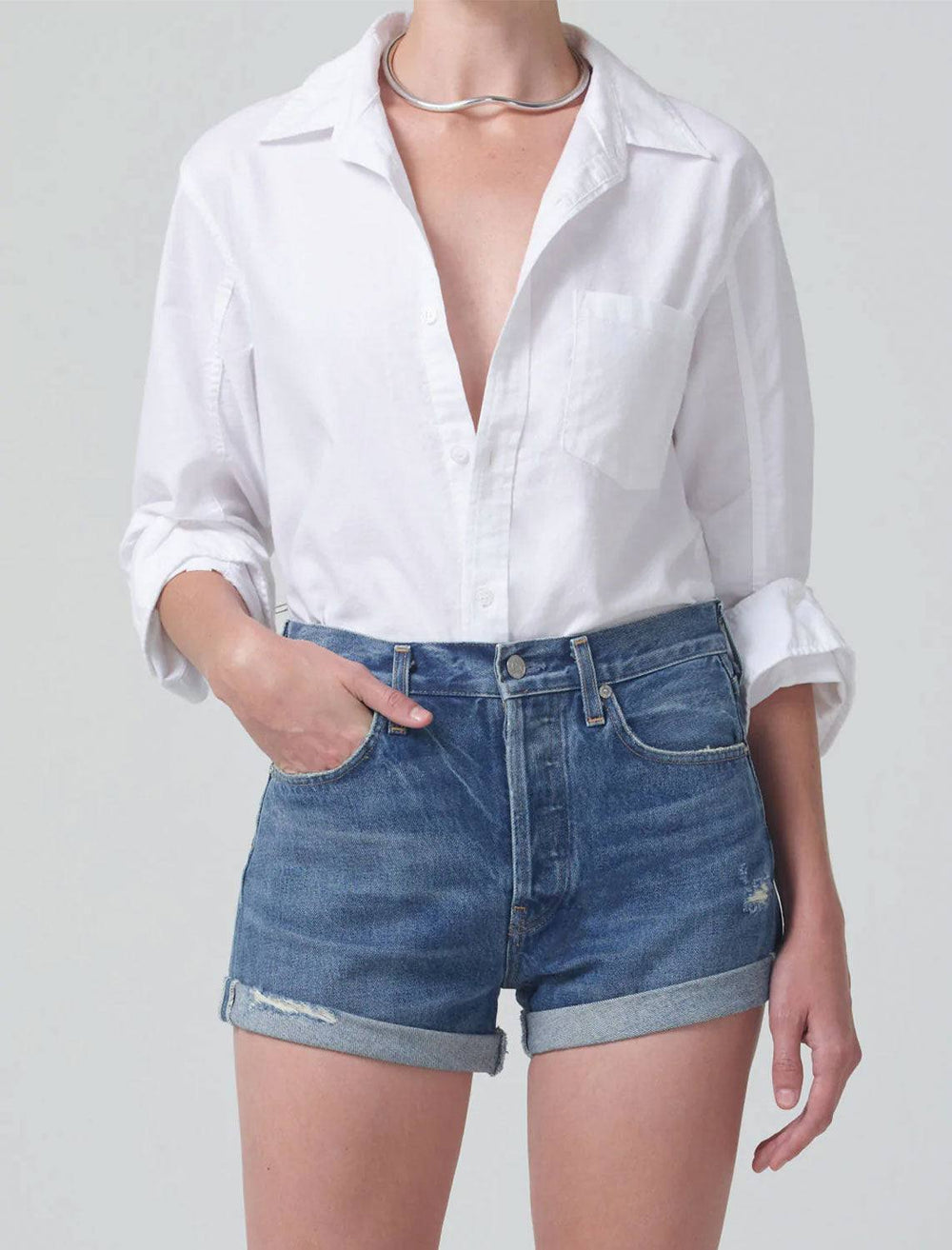 model wearing kayla shrunken shirt in optic white with jean shorts 