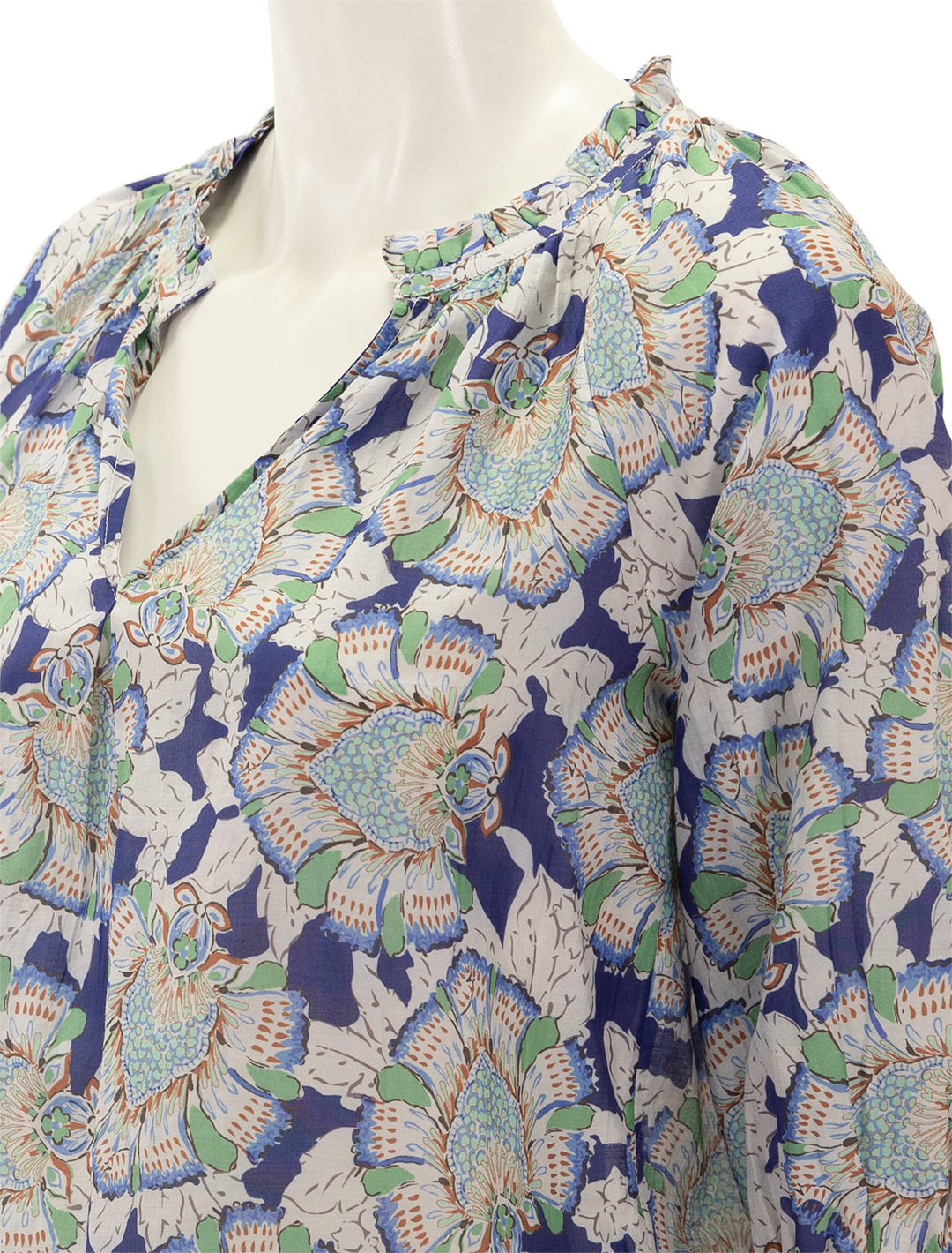 Close-up view of MABE's irie print top.