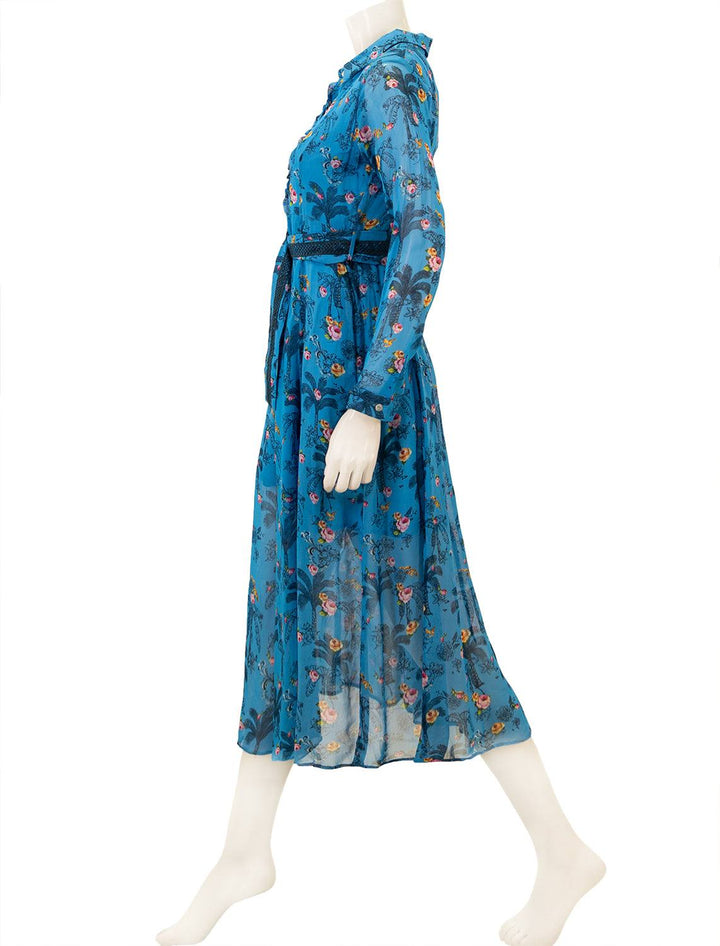 Side view of Emily Lovelock's isabella dress in blue.
