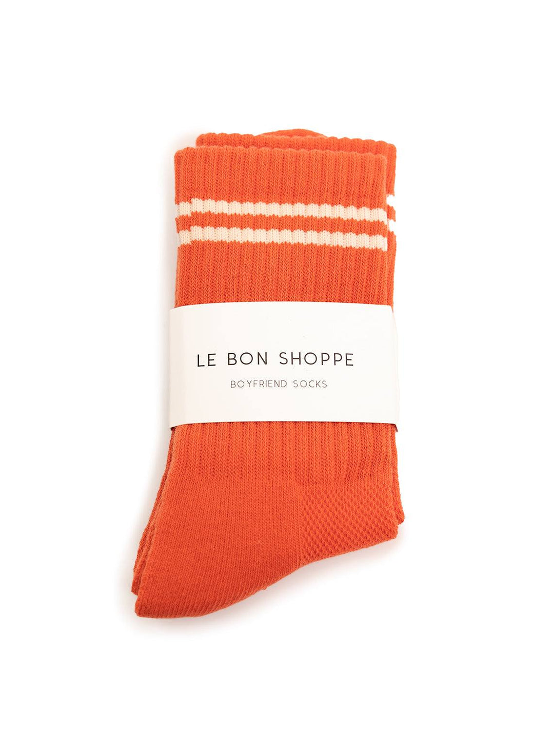 Overhead view of Le Bon Shoppe's boyfriend socks in coral.