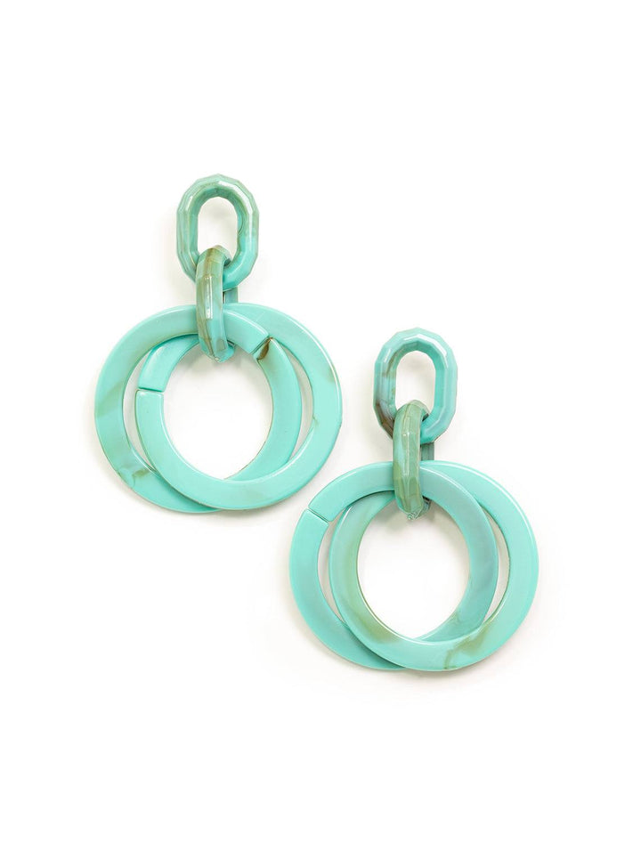 Overhead view of St. Armand's turquoise layered hoops.