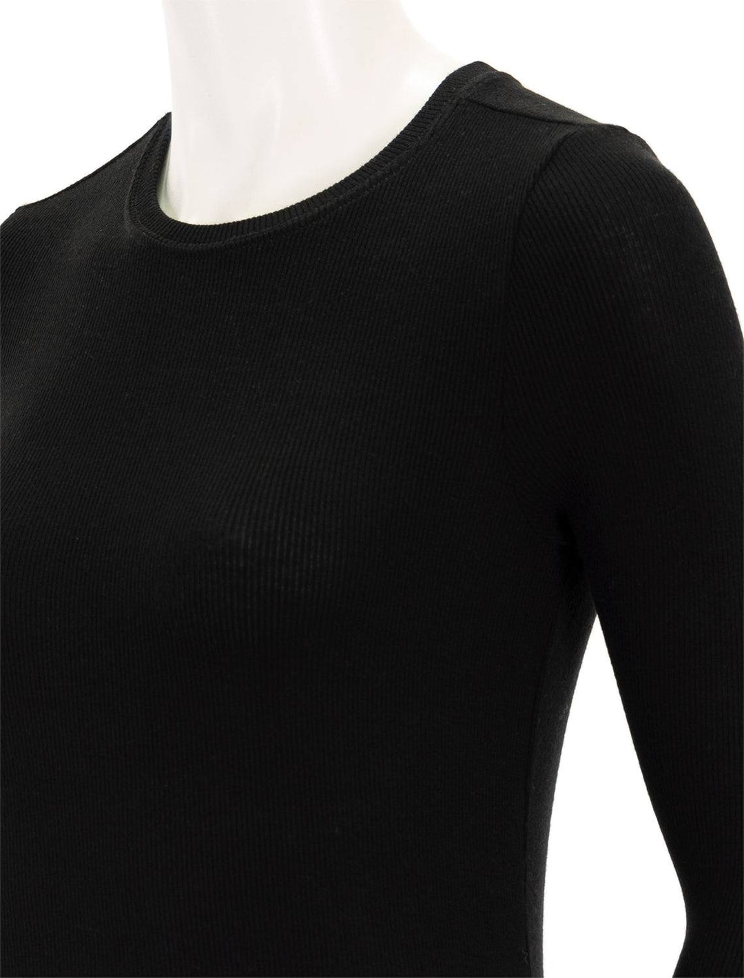 Close-up view of Goldie Lewinter's ribbed long sleeve tee in black.