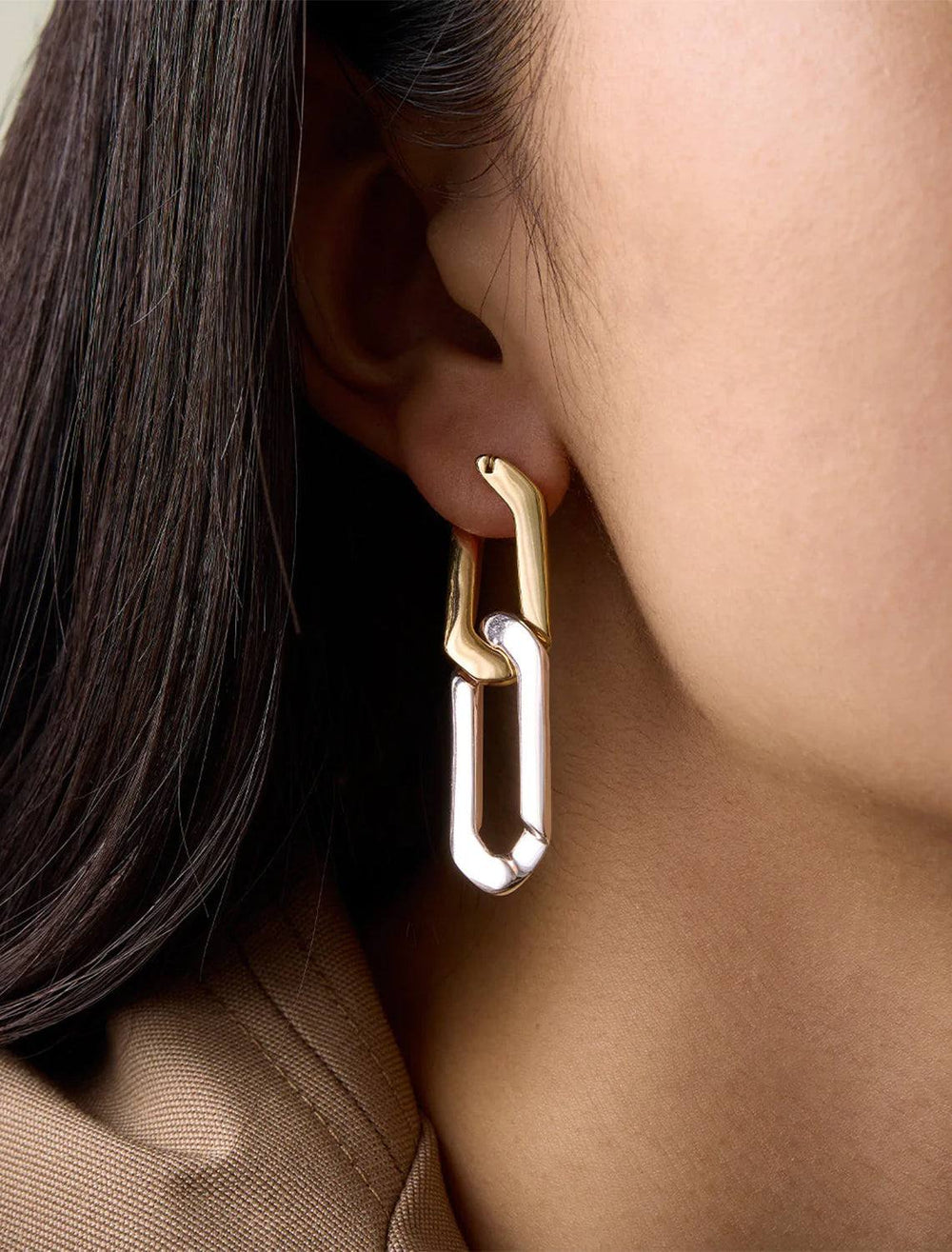 Model wearing rafael earrings in two tone