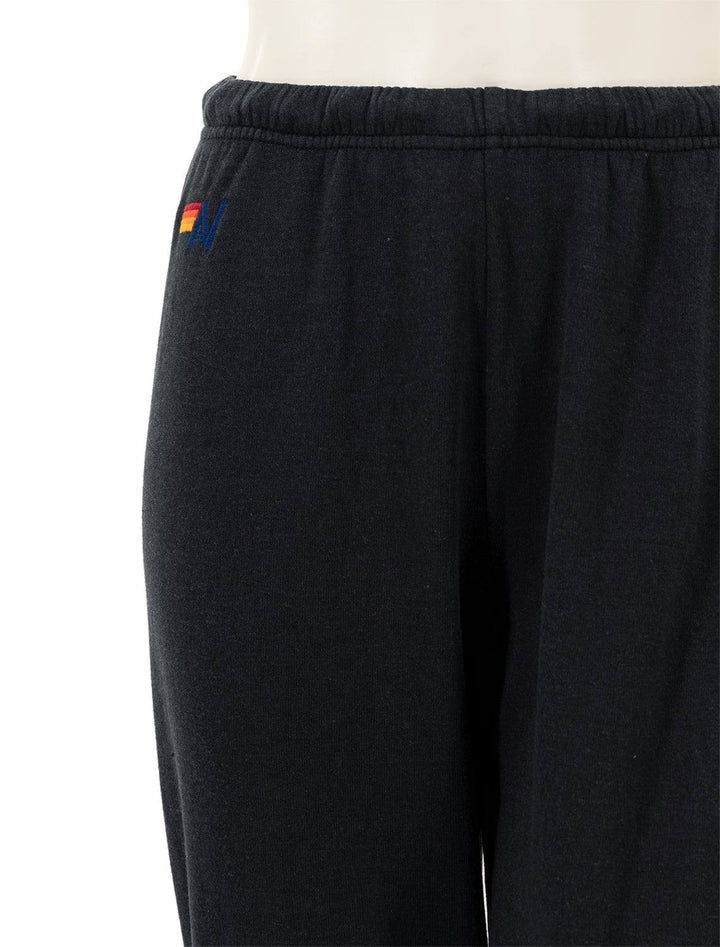 Close-up view of Aviator Nation's 5 stripe womens sweatpants in charcoal.