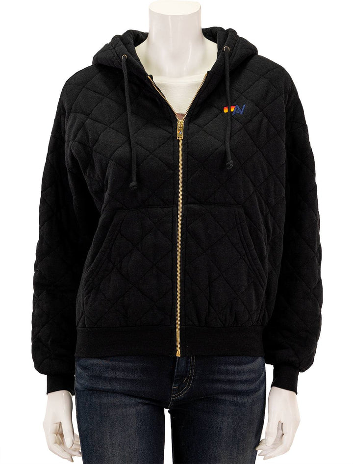 Front view of Aviator Nation's quilted zip hoodie relaxed in black.