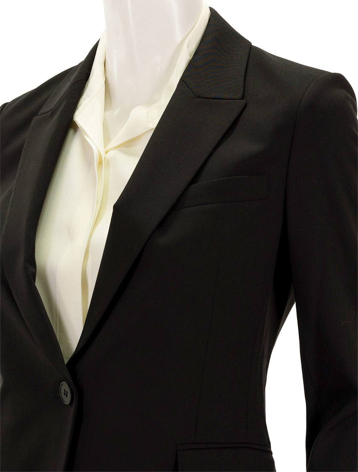 Close-up view of Theory's etiennette blazer in black.