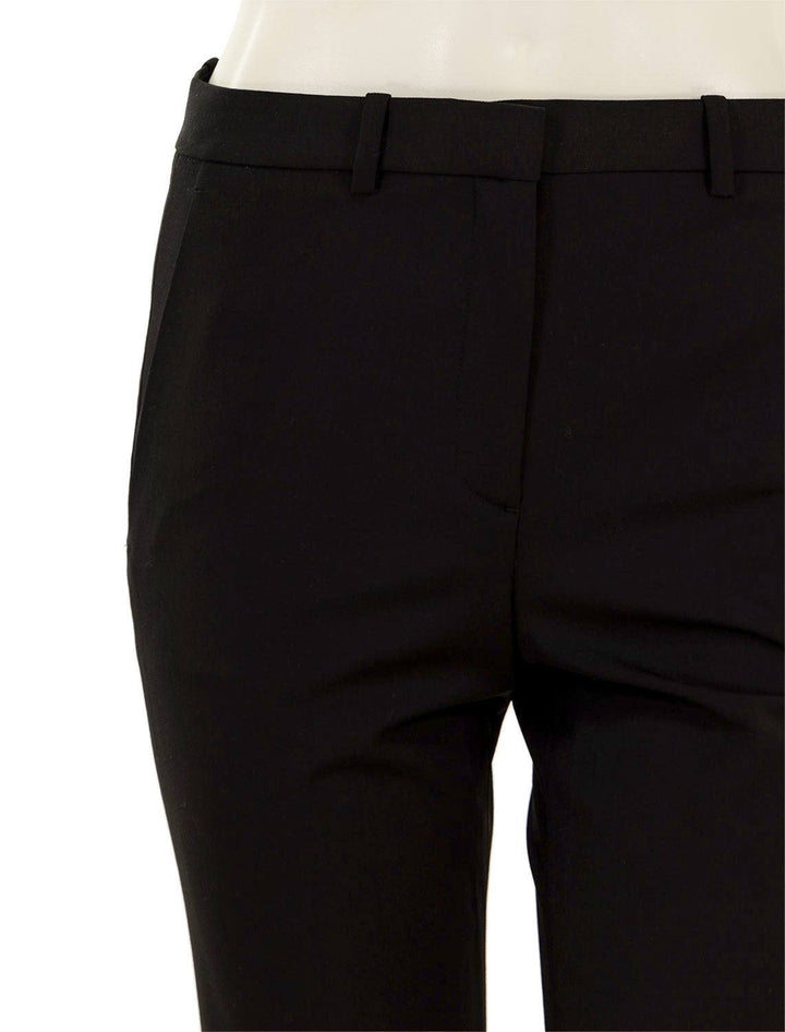 Close-up view of Theory's demetria traceable wool trousers in black.