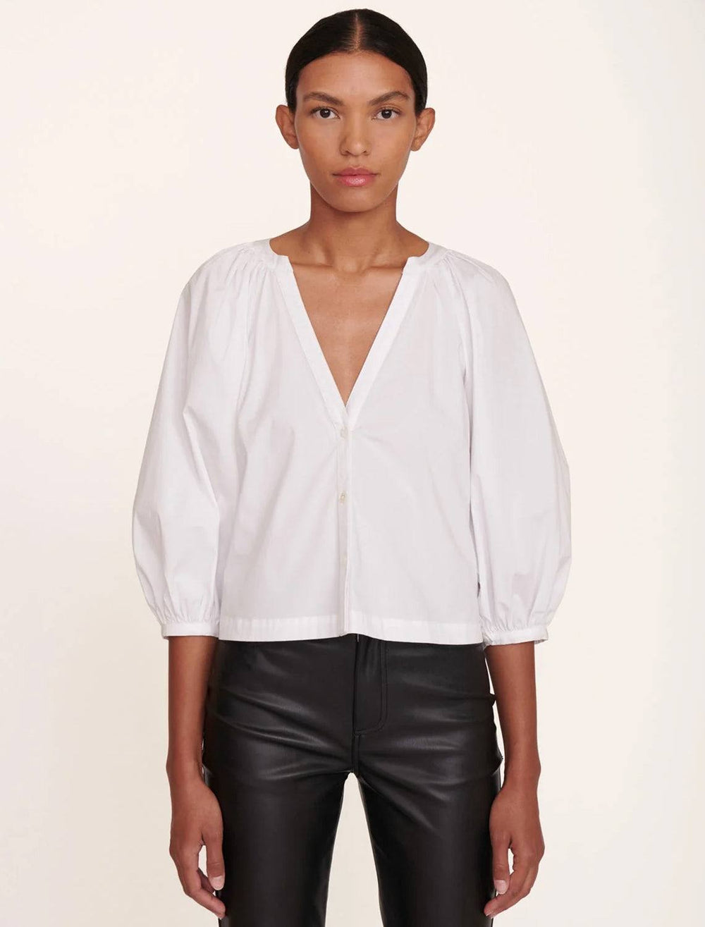 Model wearing STAUD's new dill top in white.