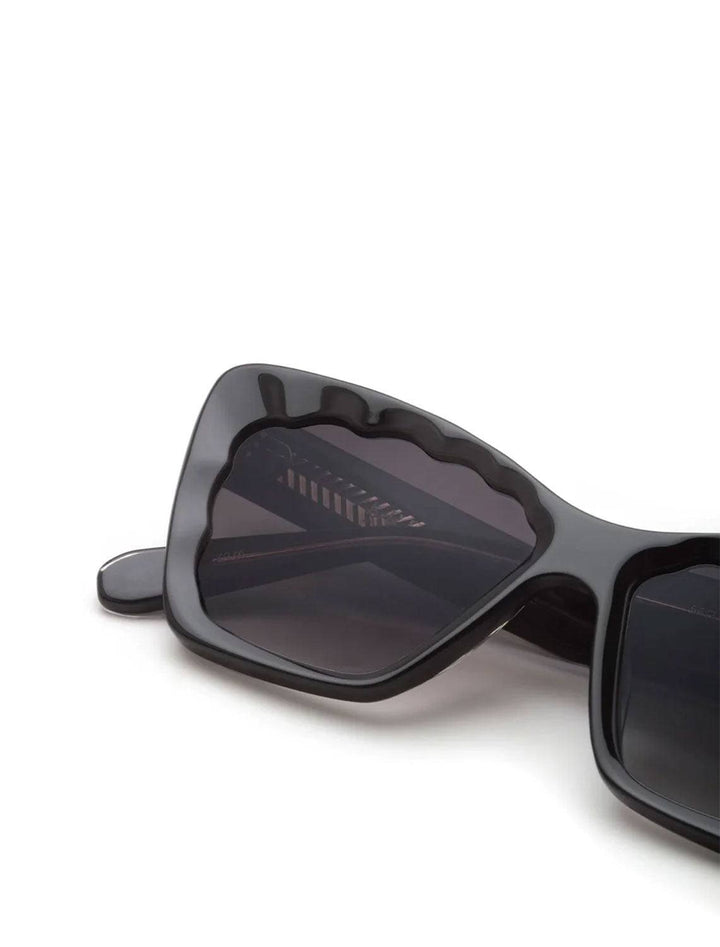 Close-up view of Krewe's brigitte sunglasses in black and black crystal.