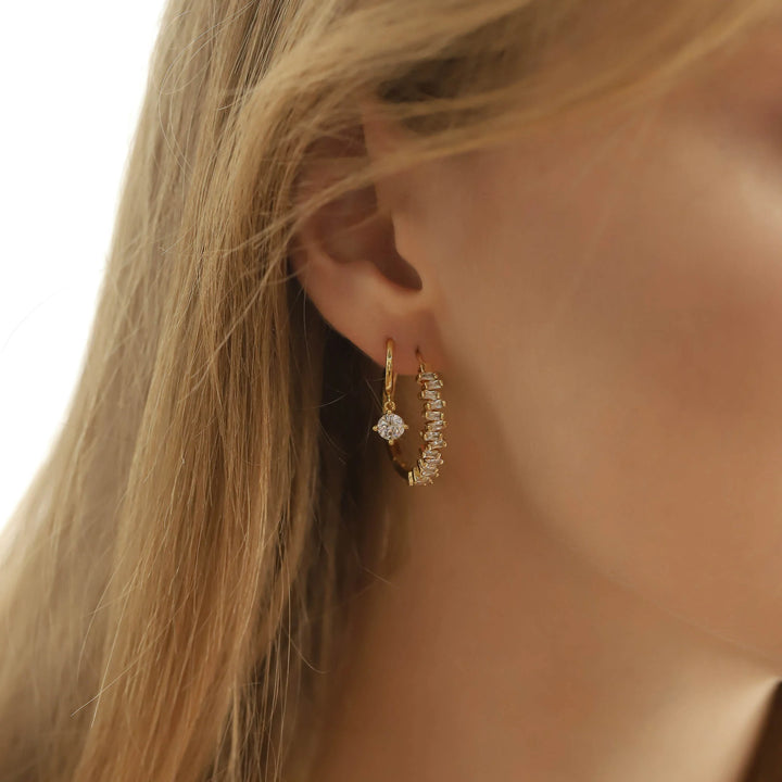 model wearing baguette cz hoops