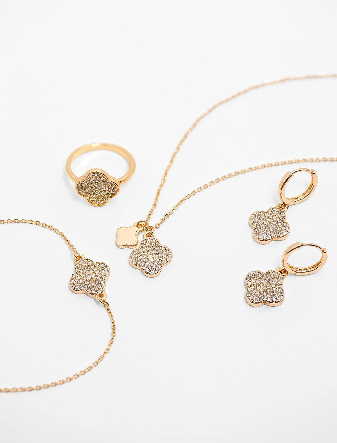 the complete four leaf charm collection from west eleventh, showing ring, bracelet, necklace and earrings
